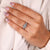 Handmade rose-inspired engagement ring with round diamonds.