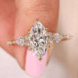Marquise diamond engagement ring in yellow gold on the Finger.