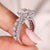 Radiant moissanite ring with matching eternity wedding band.
