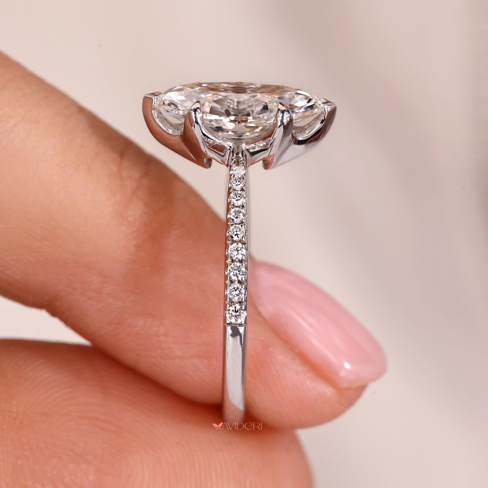 Pave setting ring with round cut diamonds and tapered shank.