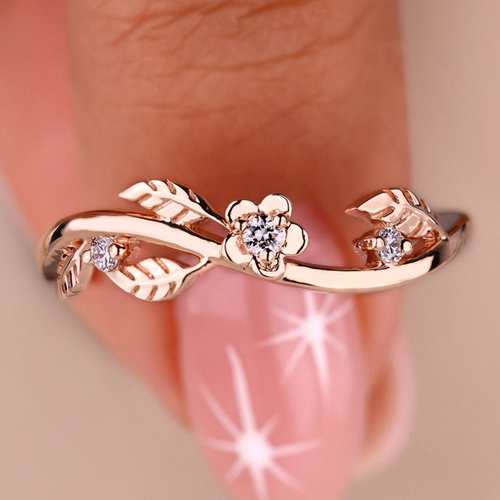 Nature inspired wedding band with delicate leaf details.