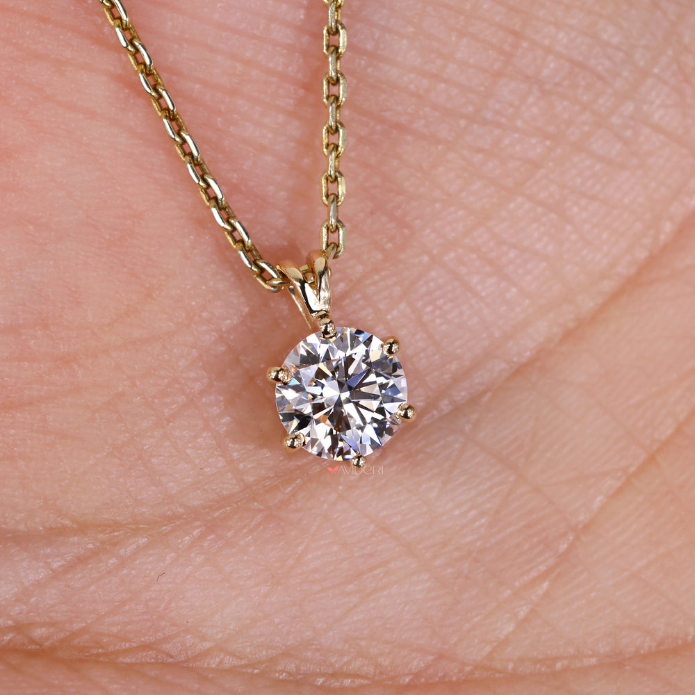 Round diamond pendant necklace with a stunning design.
