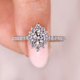 Round cut diamond ring with halo set ring.