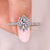 Round cut diamond ring with halo set ring.