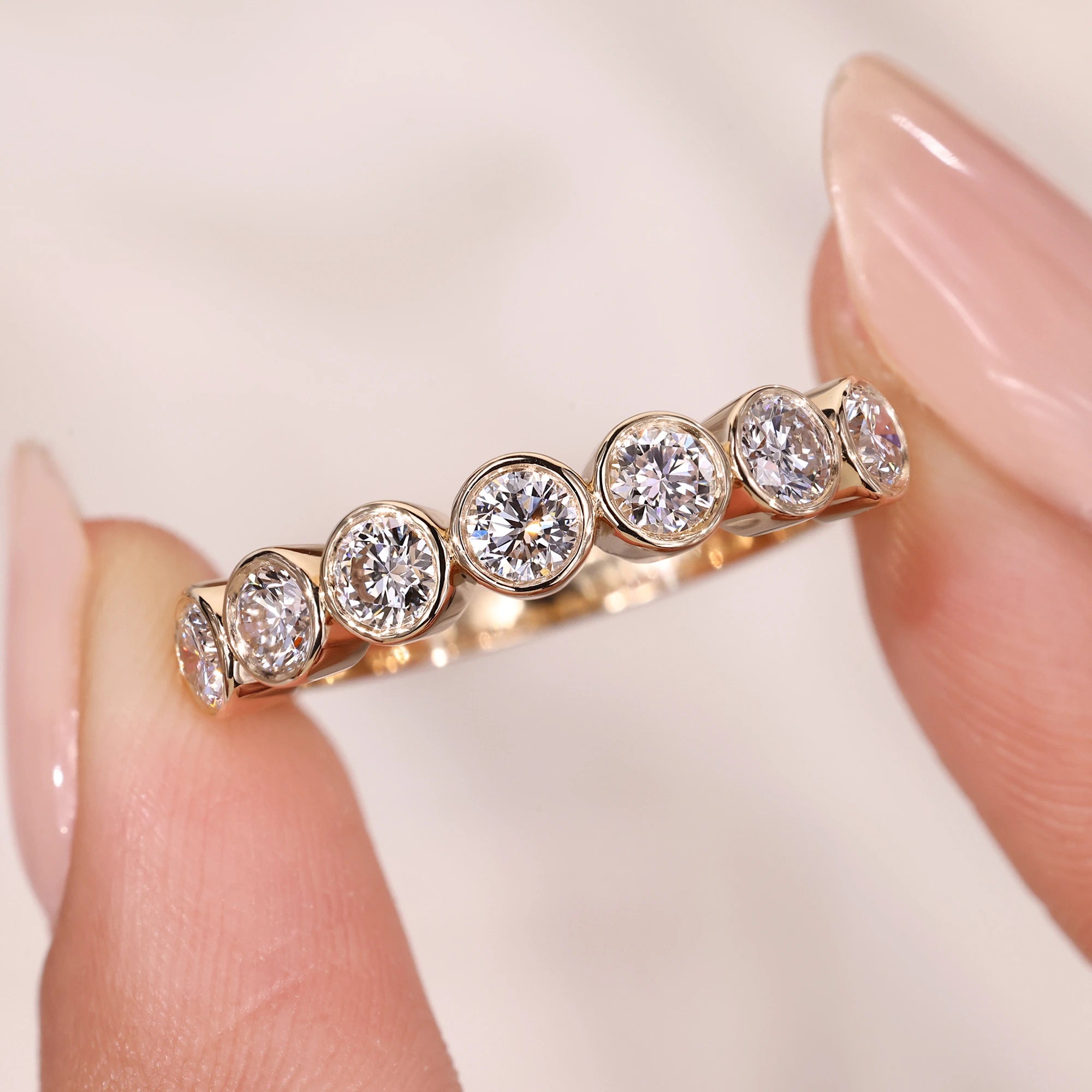 Bezel set wedding band with round diamond wedding band.