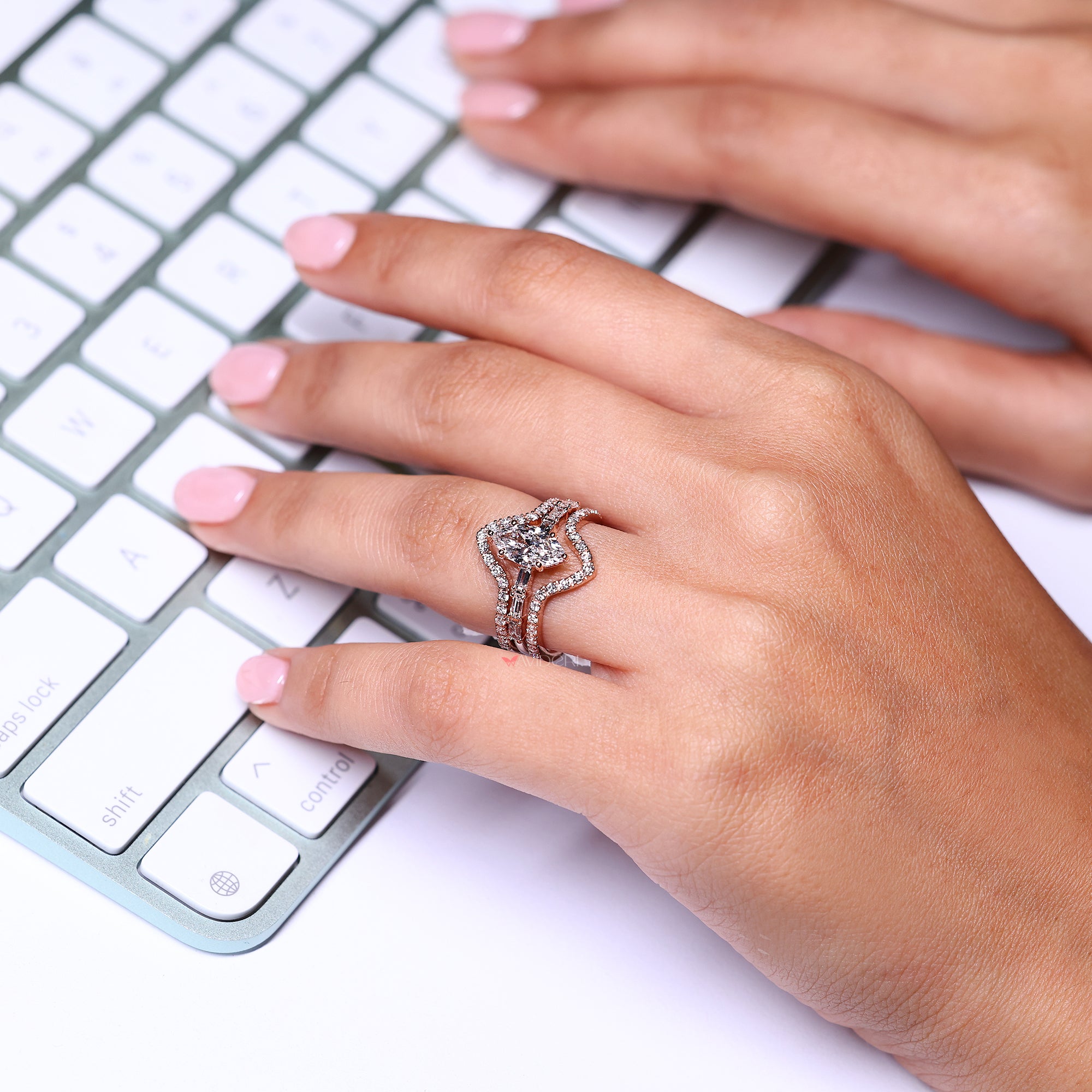 Marquise diamond ring with pave setting ring.