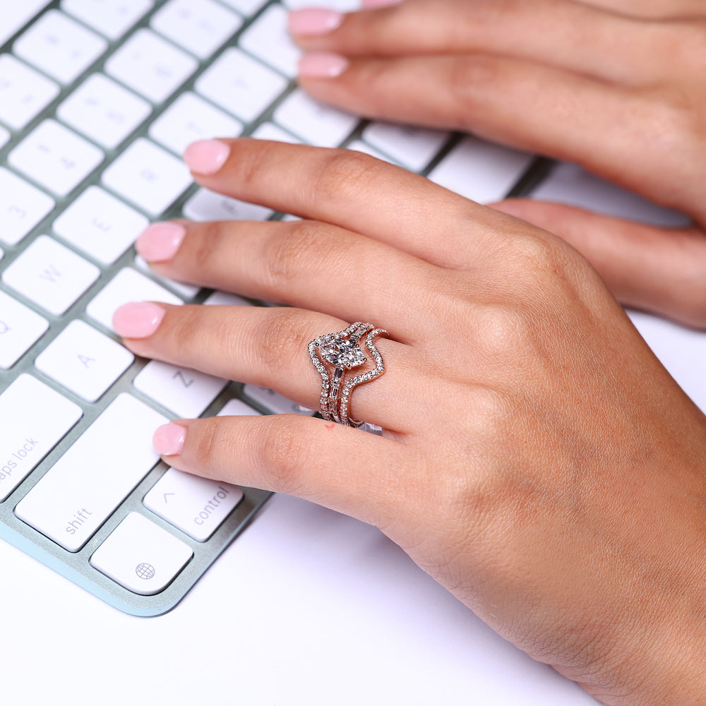 Marquise diamond ring with pave setting ring.