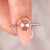 Pink diamond ring with tapered shank ring.