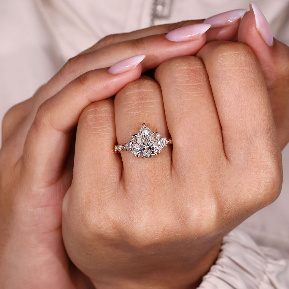 Lab grown pear cut diamond ring cluster design.
