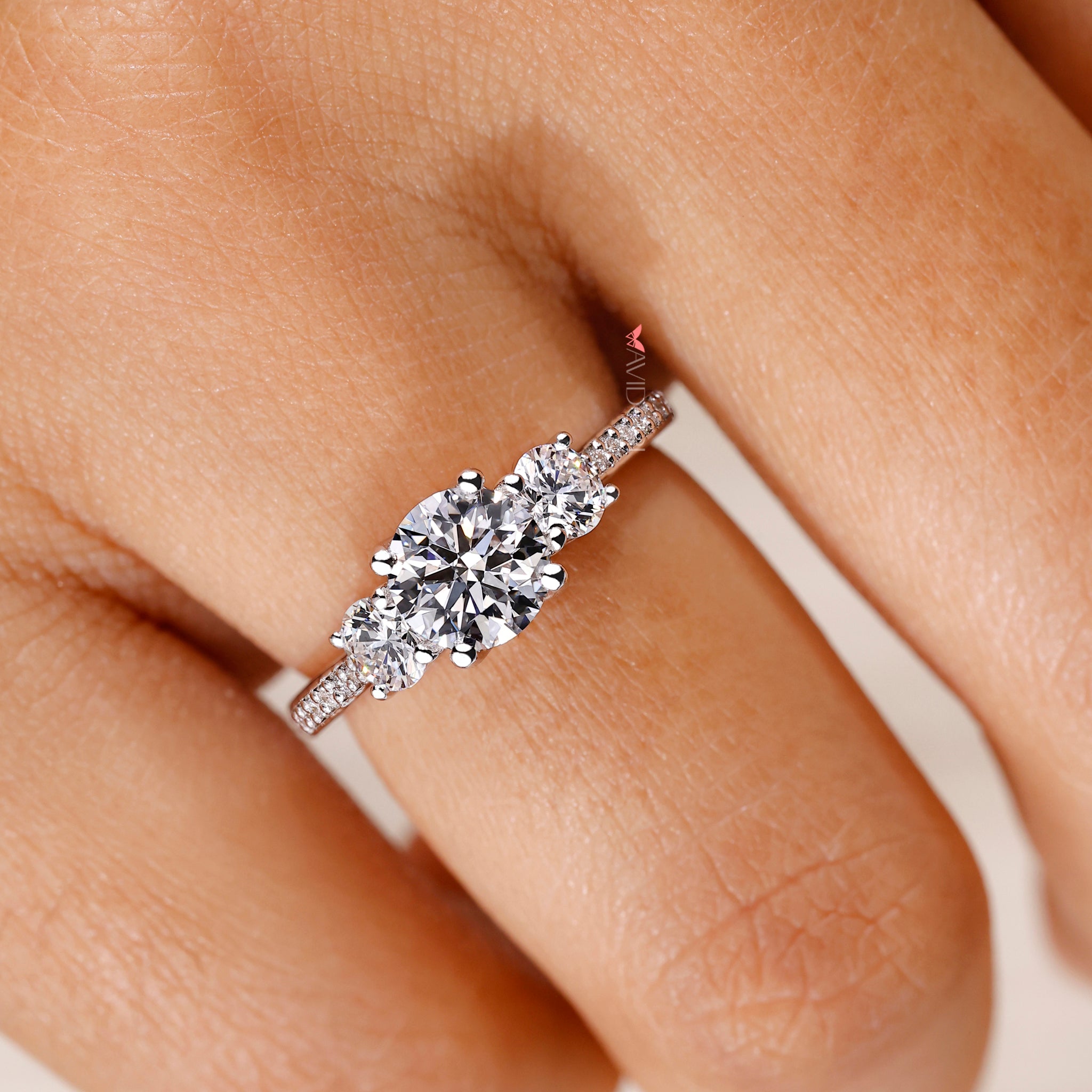 Three stone diamond ring with white gold and diamond ring.
