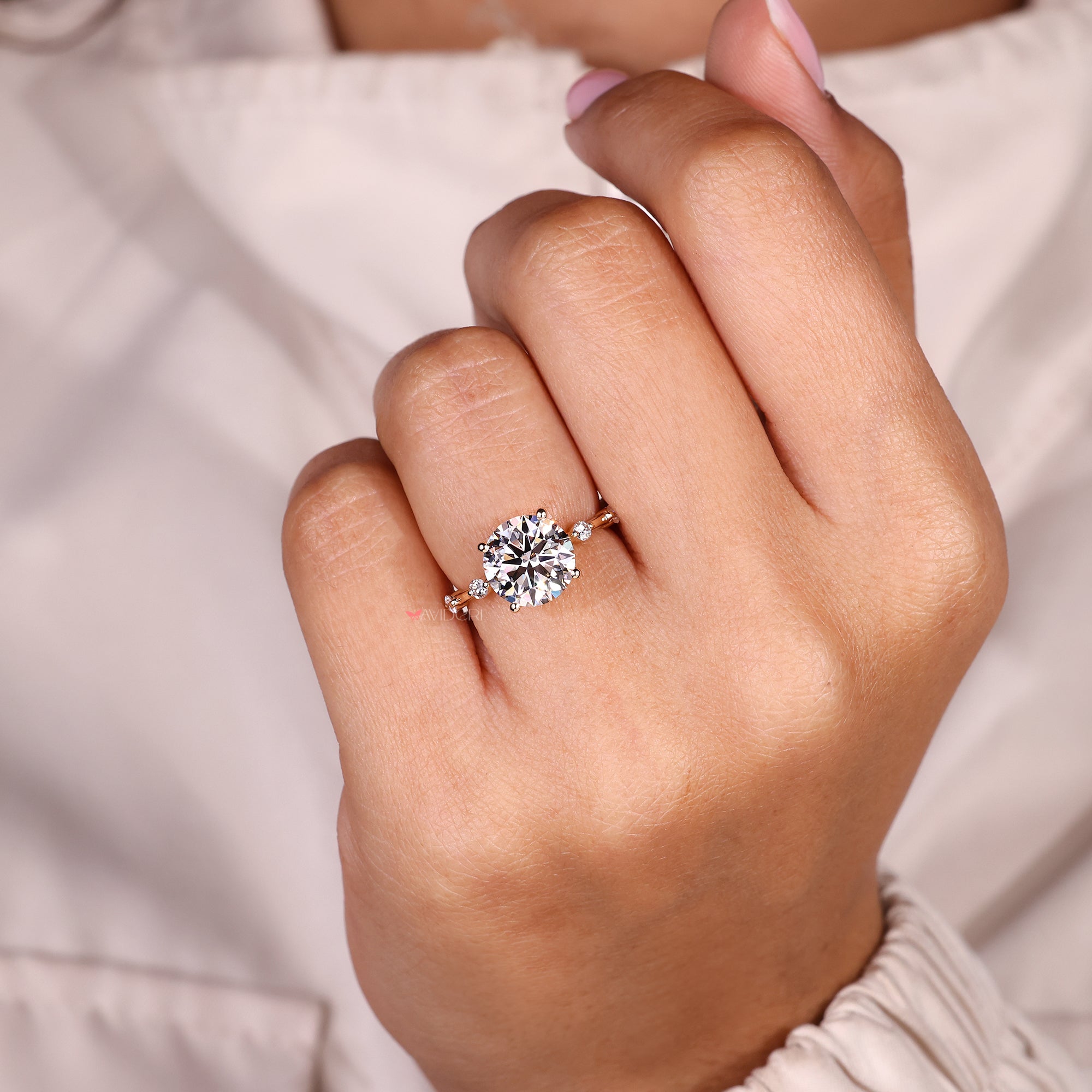 Round cut diamond ring with classic four prongs.
