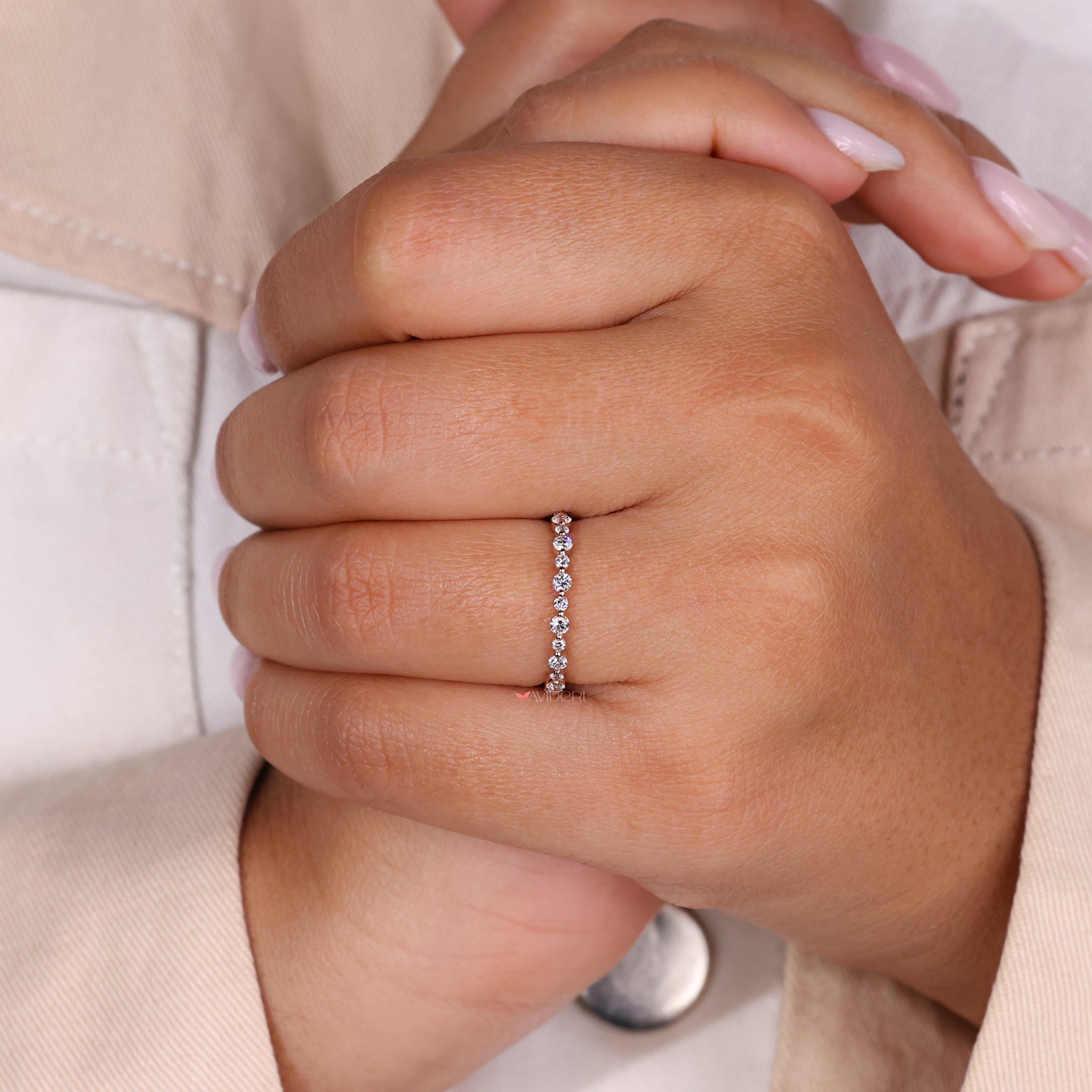 Gold eternity band featuring round diamonds in a classic round diamond eternity band.

