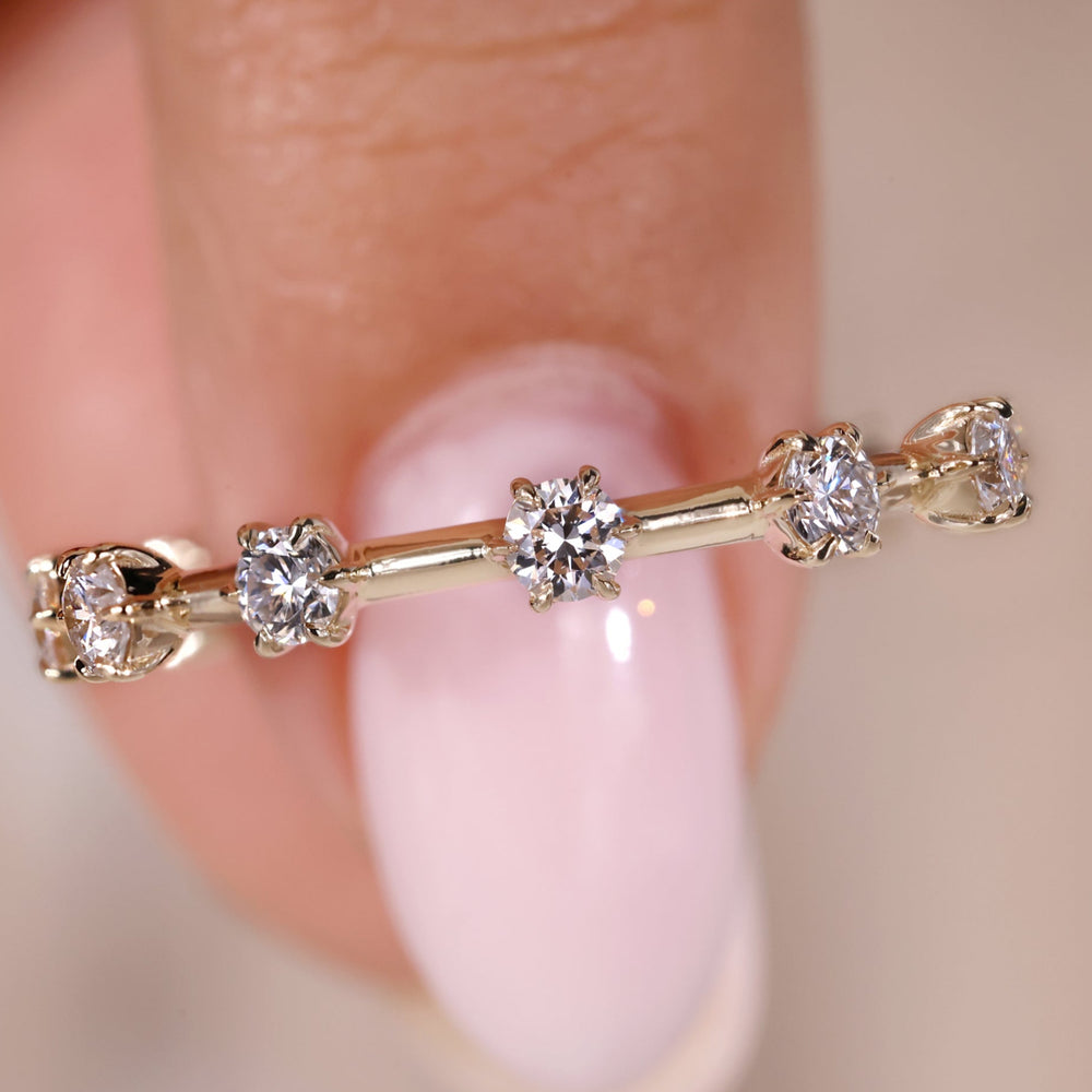 Round diamond wedding band featuring a beautiful round diamond band design.
