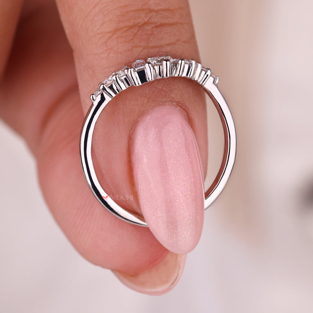 The white gold wedding band provides a classic, polished look.
