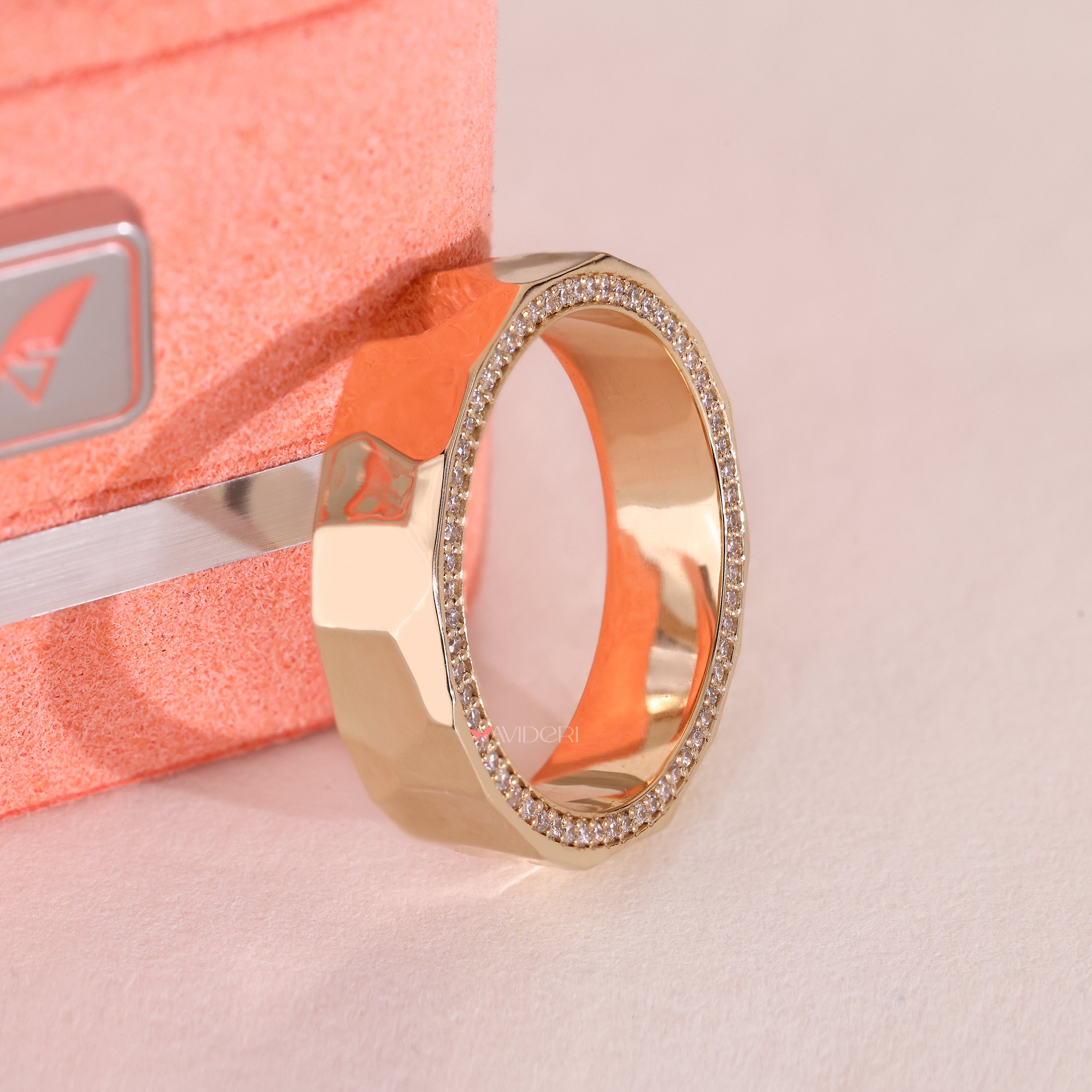 Lab grown diamond eternity band with hammered texture finish.
