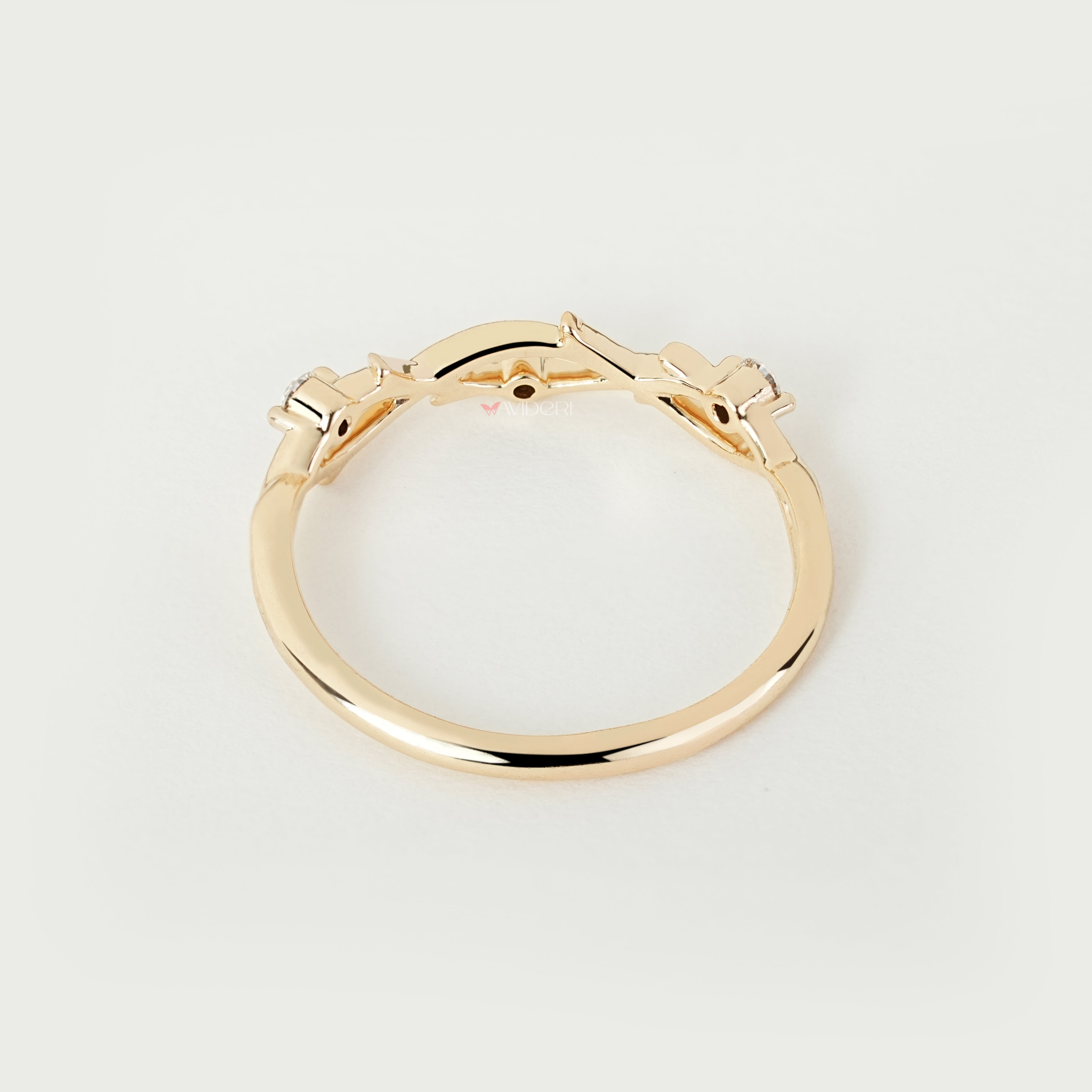 Round diamond twisted wedding band with nature inspired style
