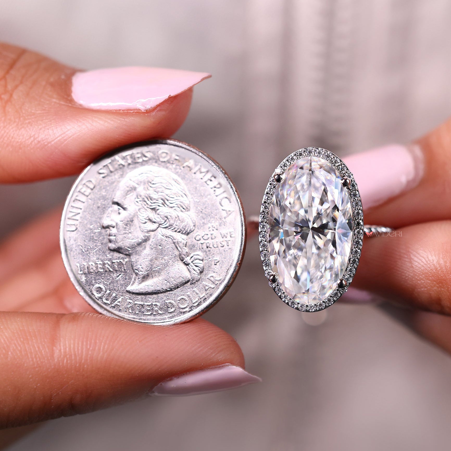 Halo engagement ring, twisted band engagement ring, moissanite engagement ring.