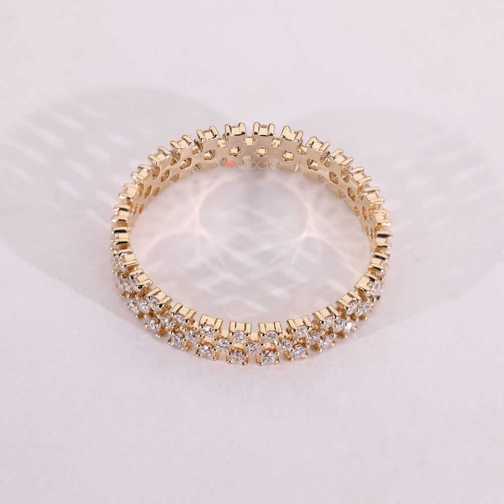 Yellow gold wedding band with round moissanite.