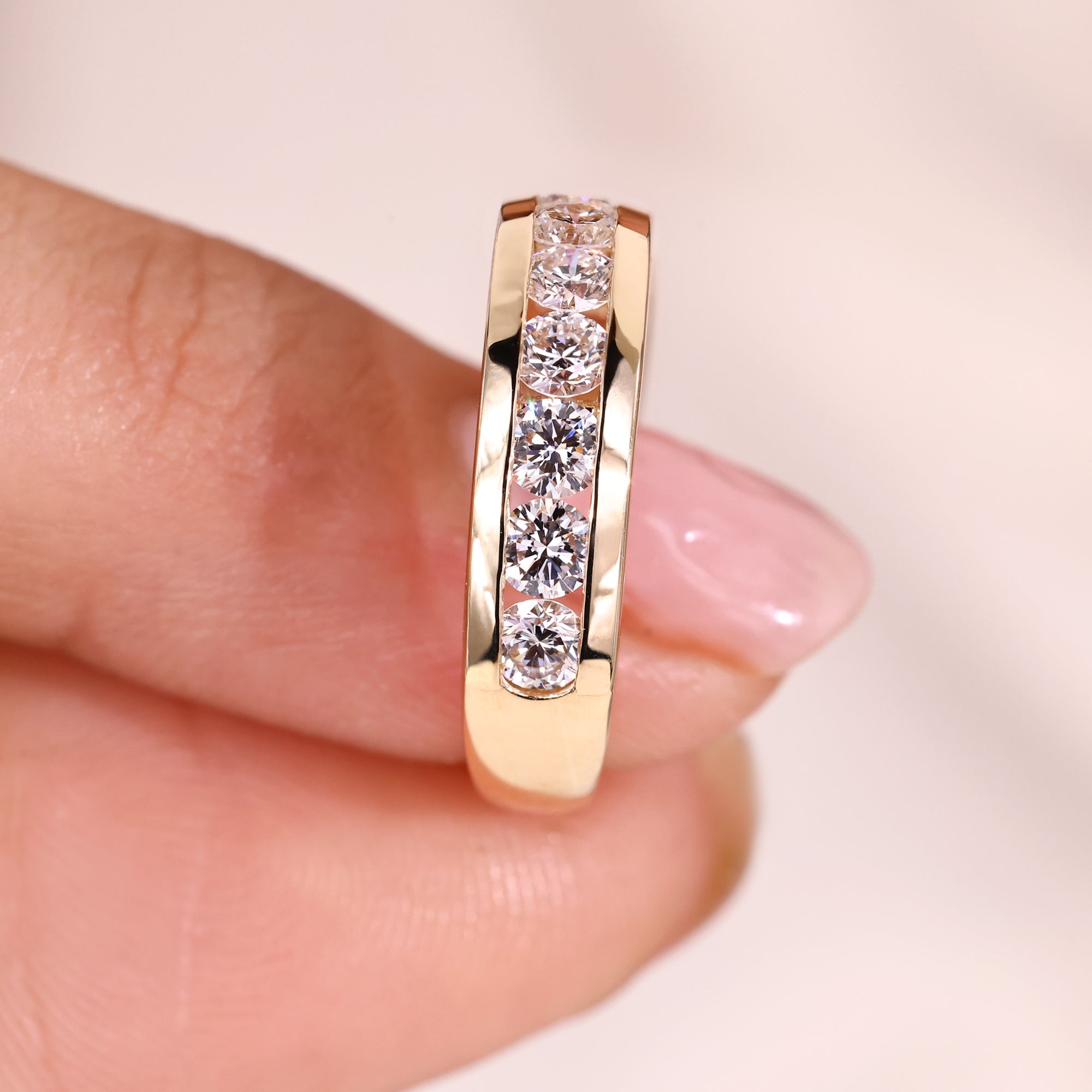 Lab grown diamond wedding band with clear stones.