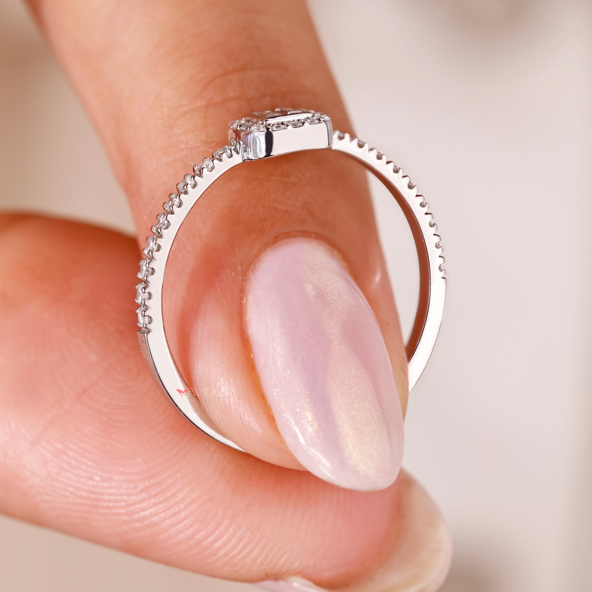 white gold engagement ring with bezel setting and custom handmade finish.