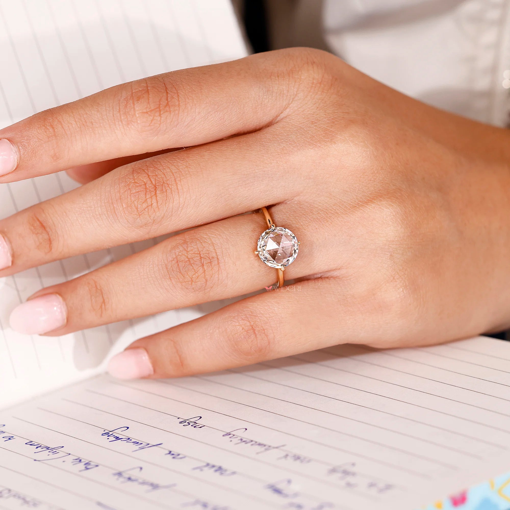 Solitaire engagement ring with yellow gold engagement ring.