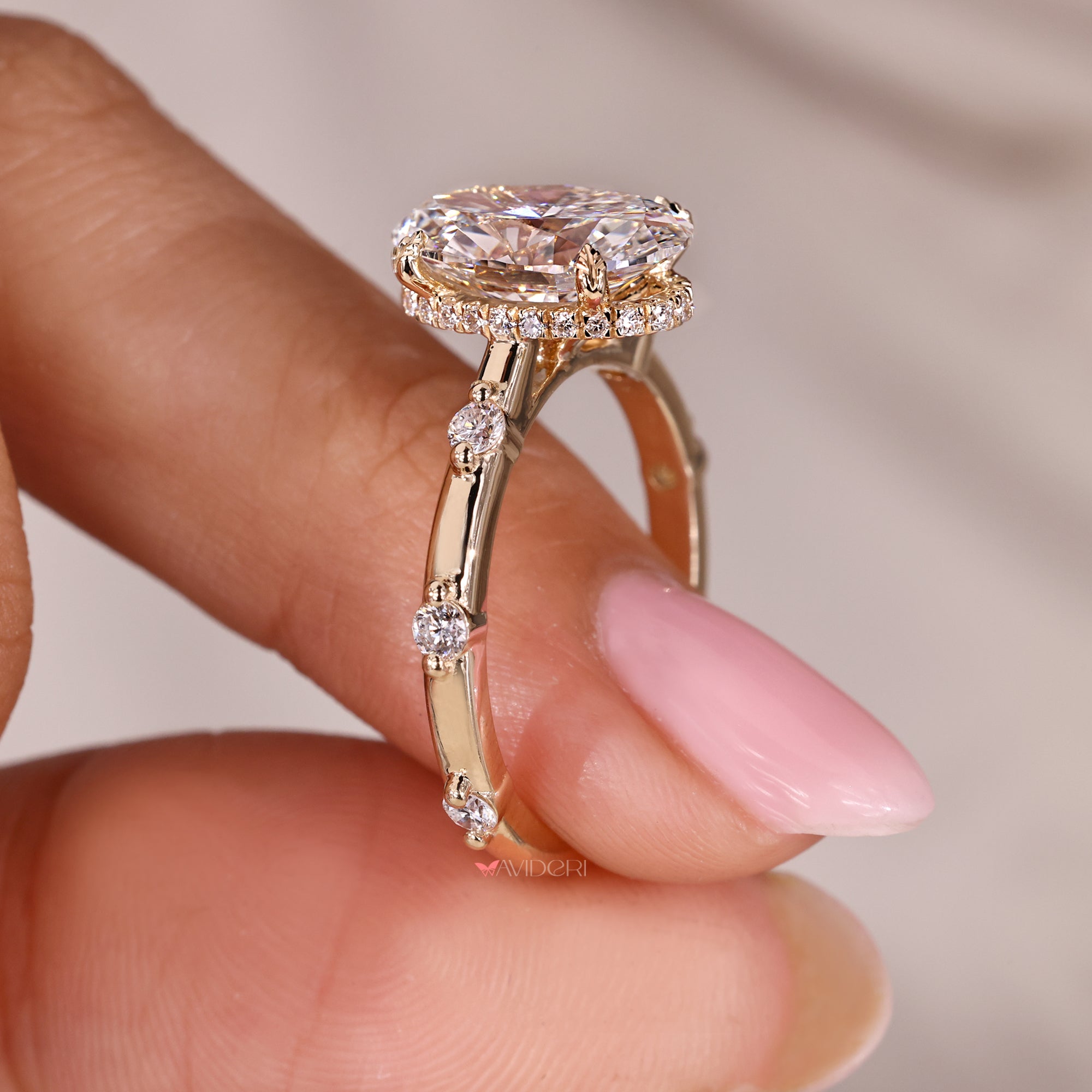 Round cut hidden halo setting adds sparkle around center stone.