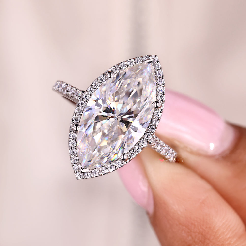 V prong marquise engagement ring with cathedral design.