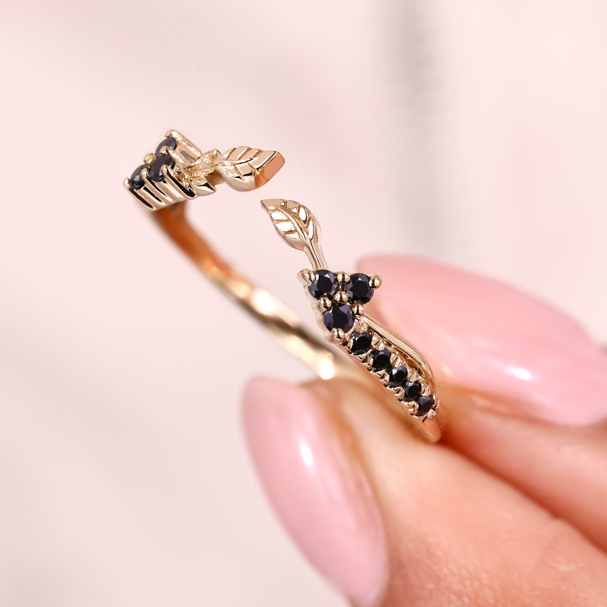 Handmade jewelry band with black moissanite and nature inspired design.