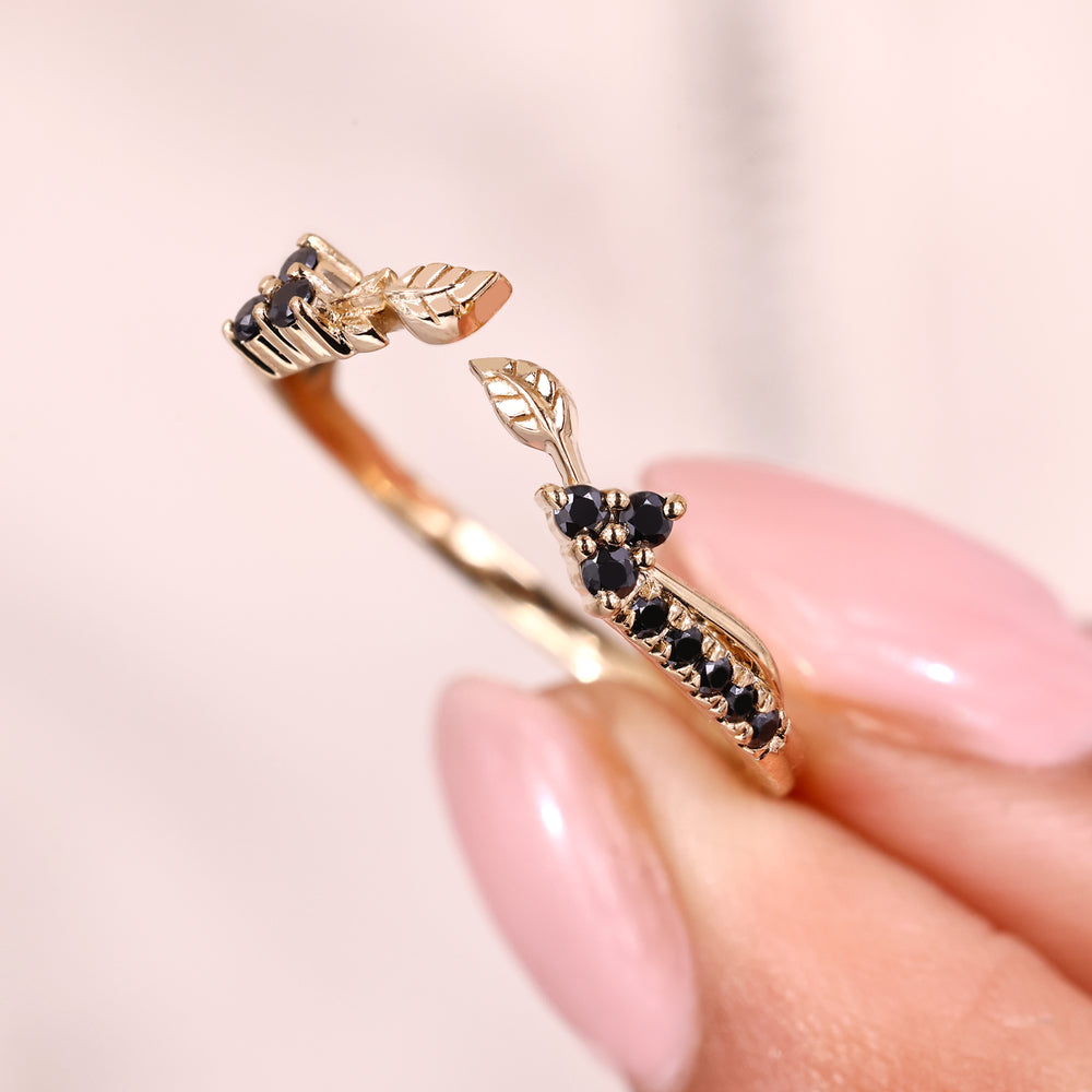 Handmade jewelry band with black moissanite and nature inspired design.