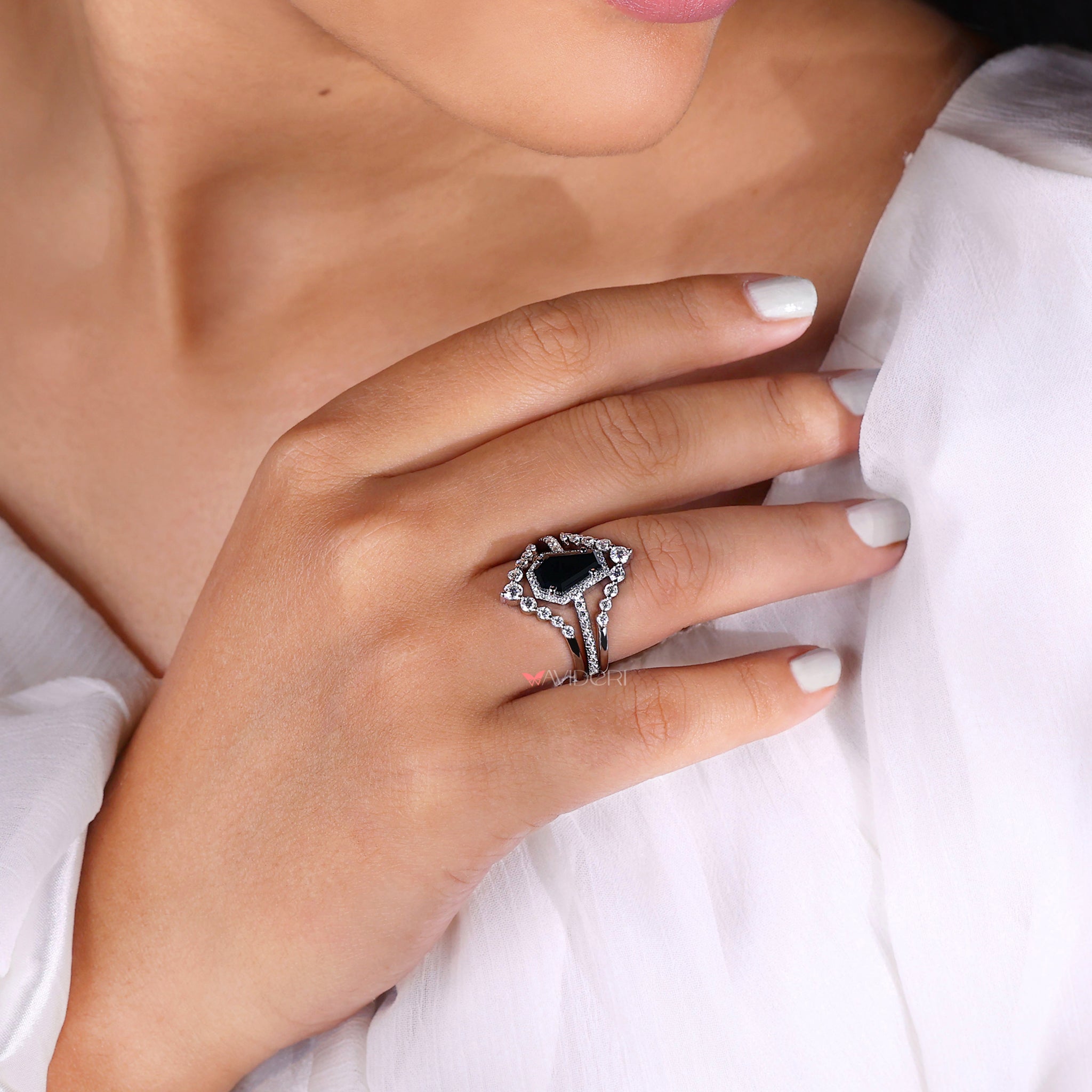 Round engagement ring styled in a coffin ring design for a modern twist.