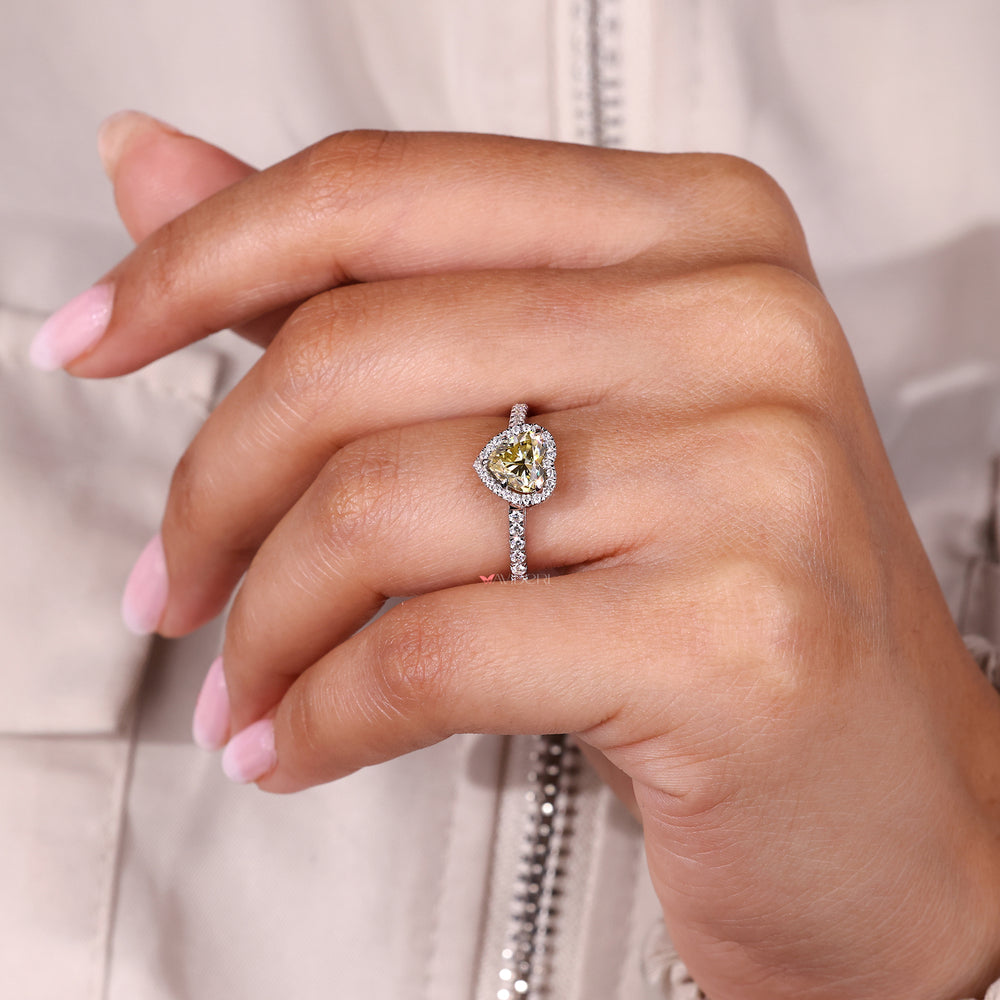 Canary yellow heart cut moissanite halo ring.