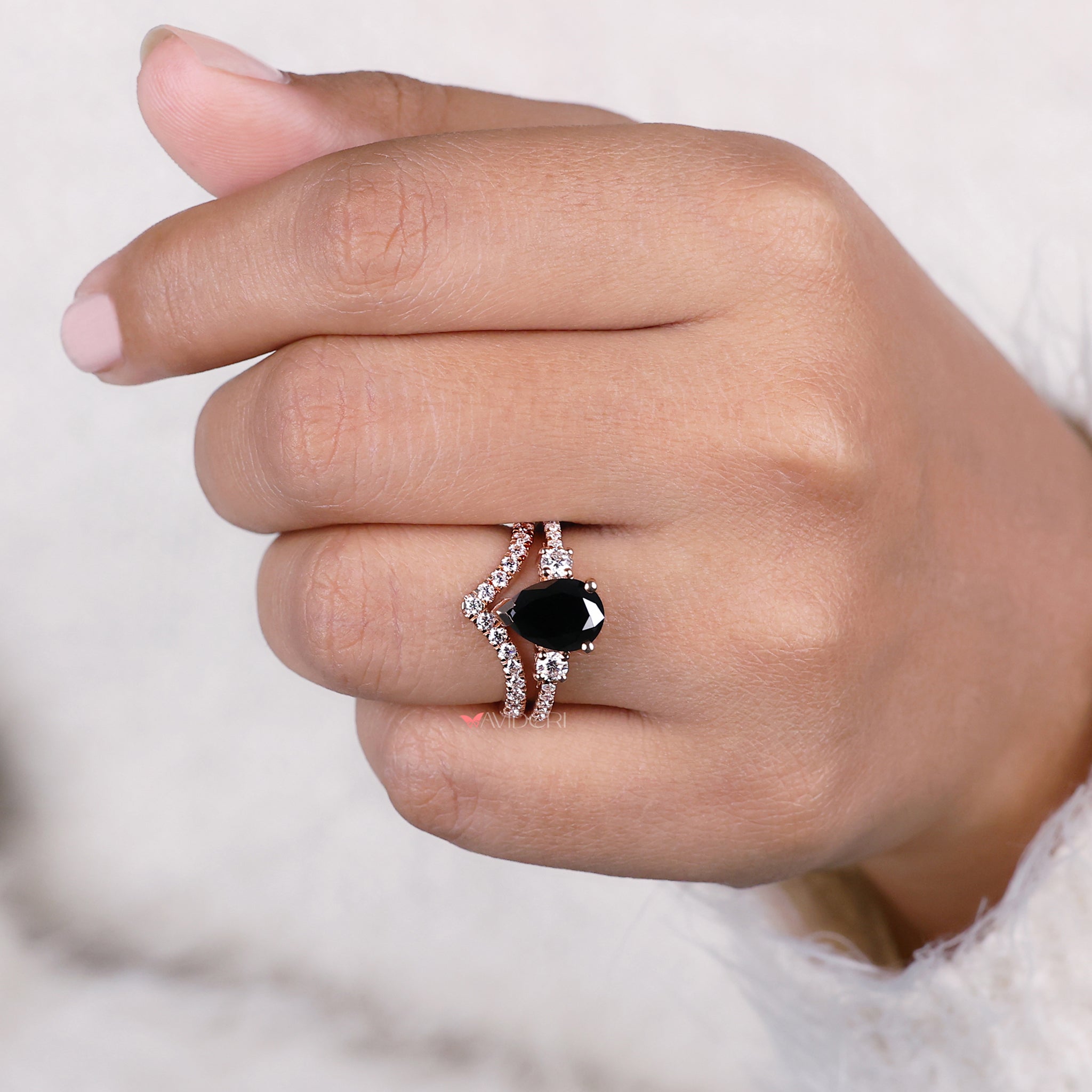 V prong ring showcasing a pear shaped diamond for a secure and elegant look.
