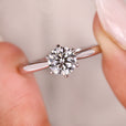 Solitaire engagement ring with round diamond.