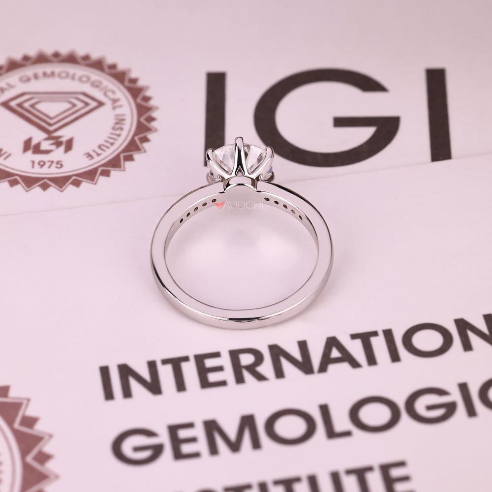 Round cut lab diamond ring with pave round diamonds
