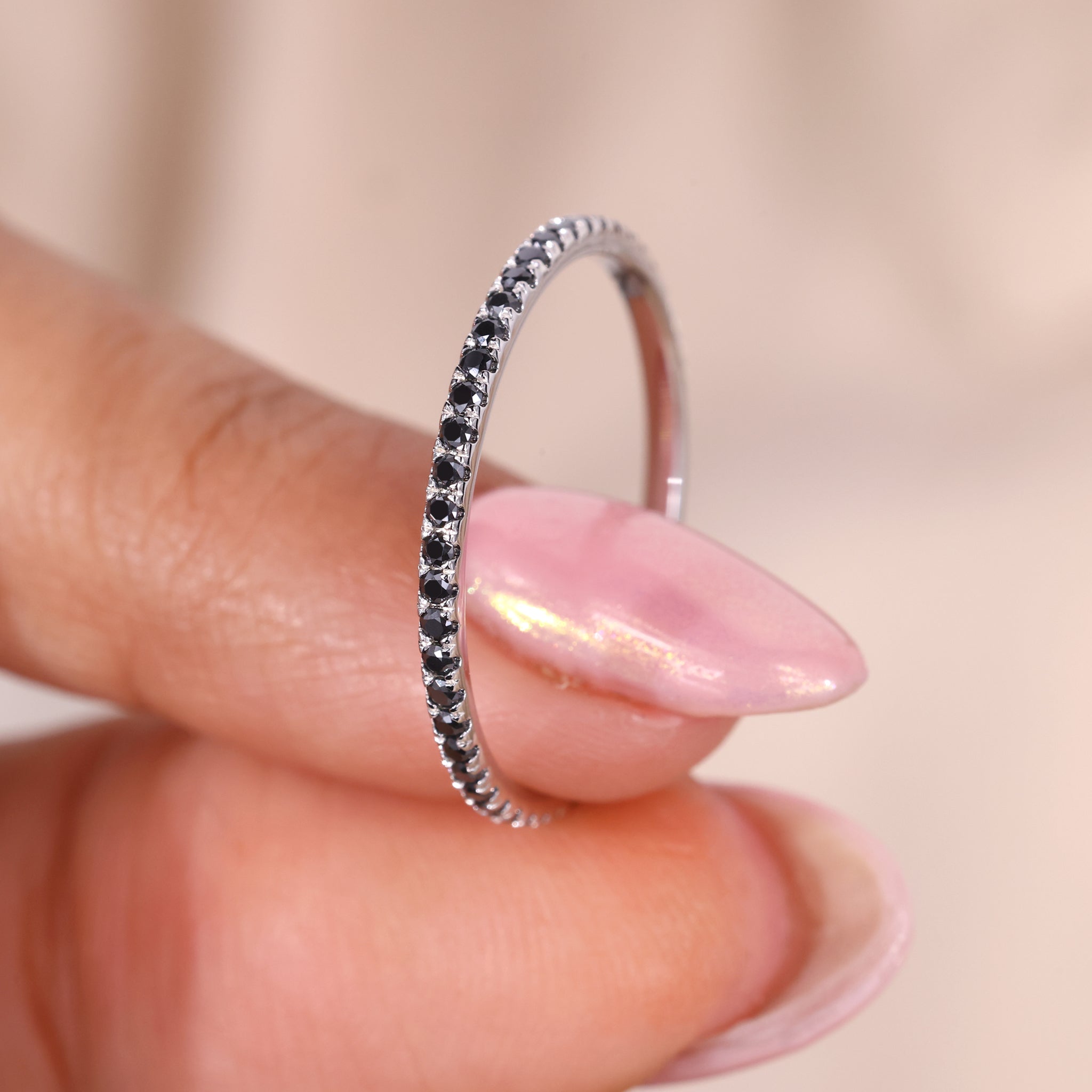 White gold eternity band with a round cut wedding band design.