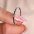 White gold eternity band with a round cut wedding band design.