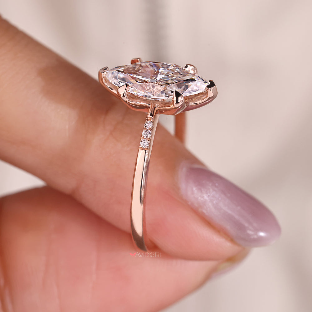 Four claw prong setting holds the marquise diamond firmly in place.
