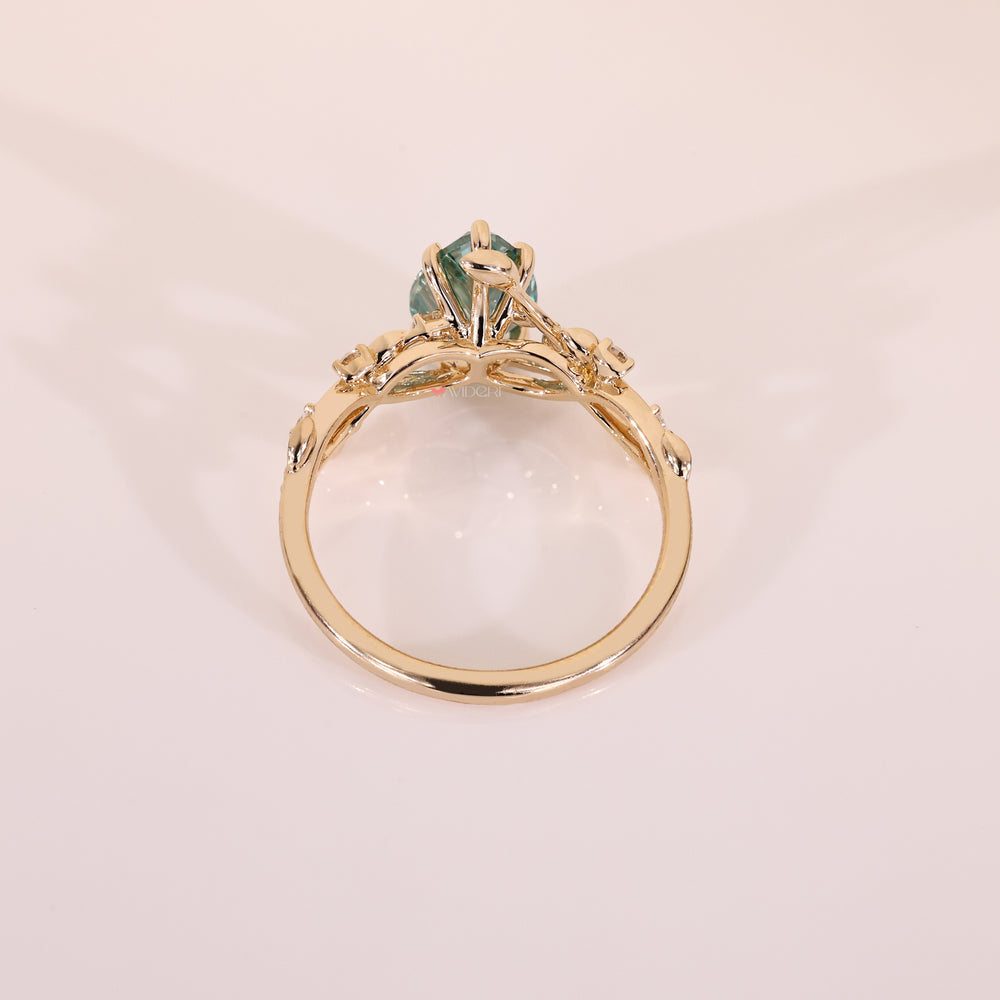Yellow gold engagement ring with round cut side stone.