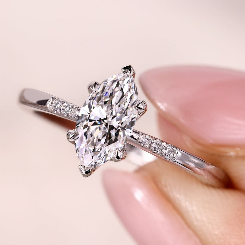 4 claw prong setting on marquise cut diamond engagement ring.