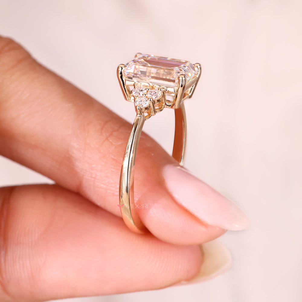 Lab grown emerald cut diamond engagement ring.
