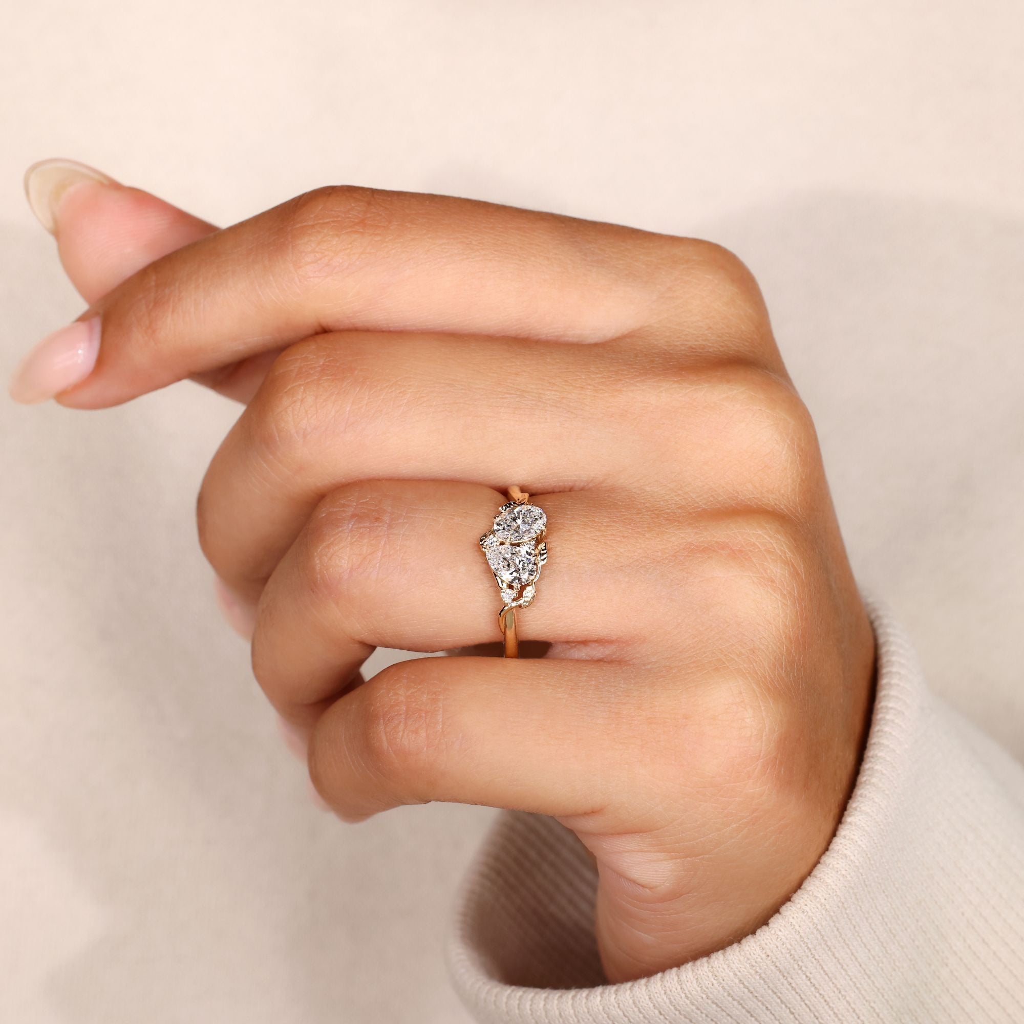 Lab grown diamond toi et moi ring with side stones.
