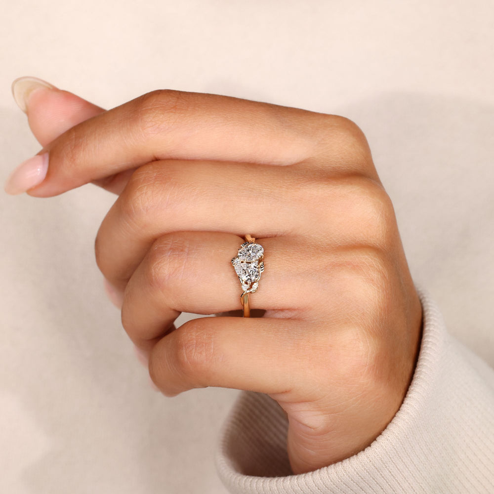 Lab grown diamond toi et moi ring with side stones.
