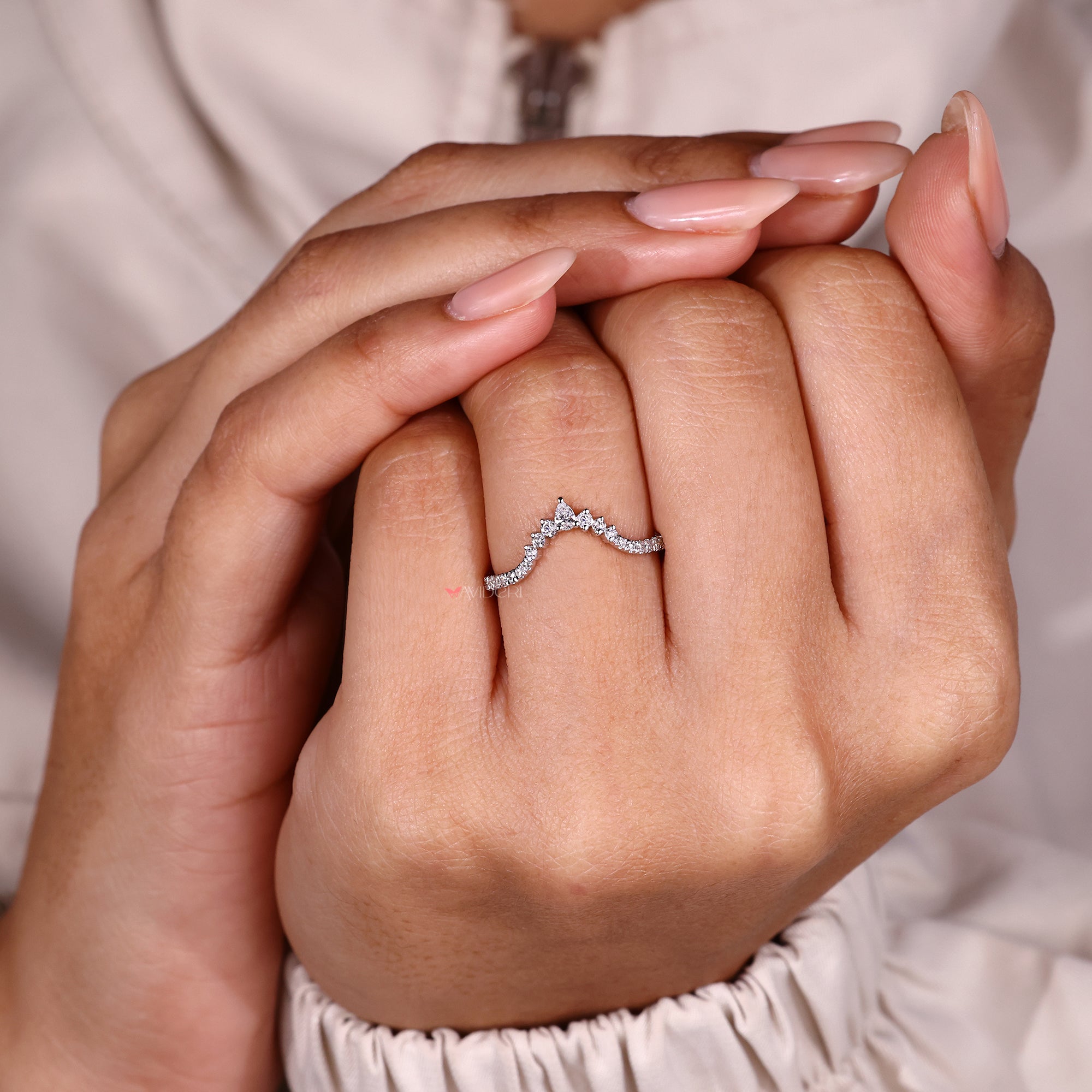 Minimal chevron wedding band with diamonds.
