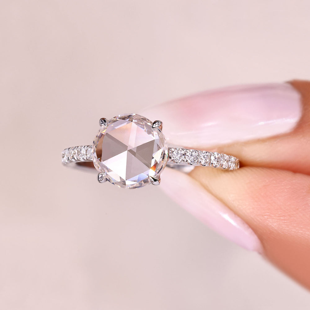 Rose cut diamond ring featuring round diamond pave accents.
