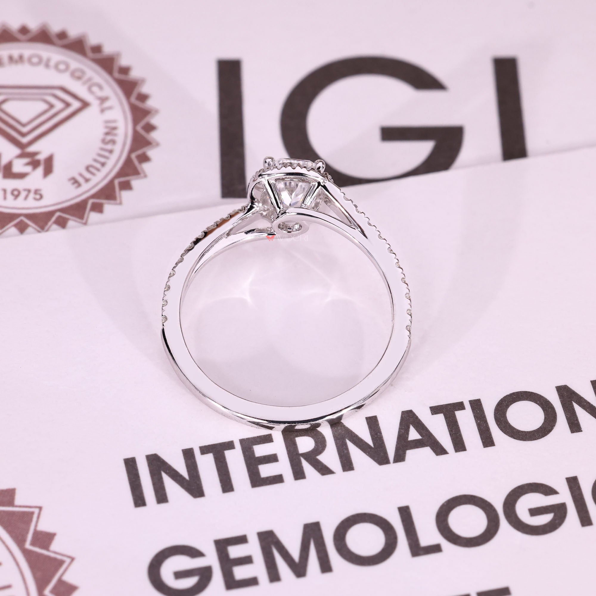 IGI certified cushion cut diamond ring with halo.
