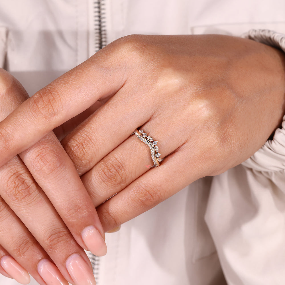 Curved wedding band with round diamonds.

