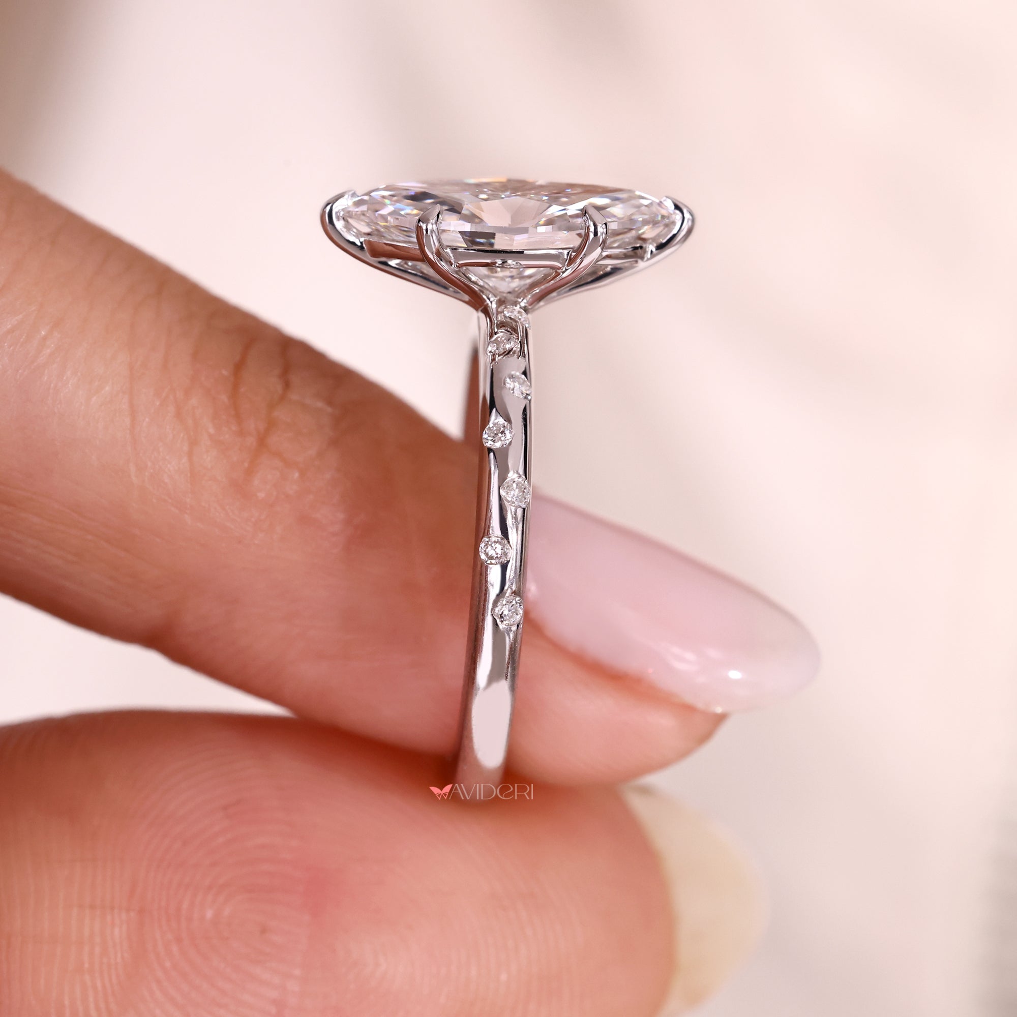 Lab grown marquise cut diamond ring with six claw prongs.

