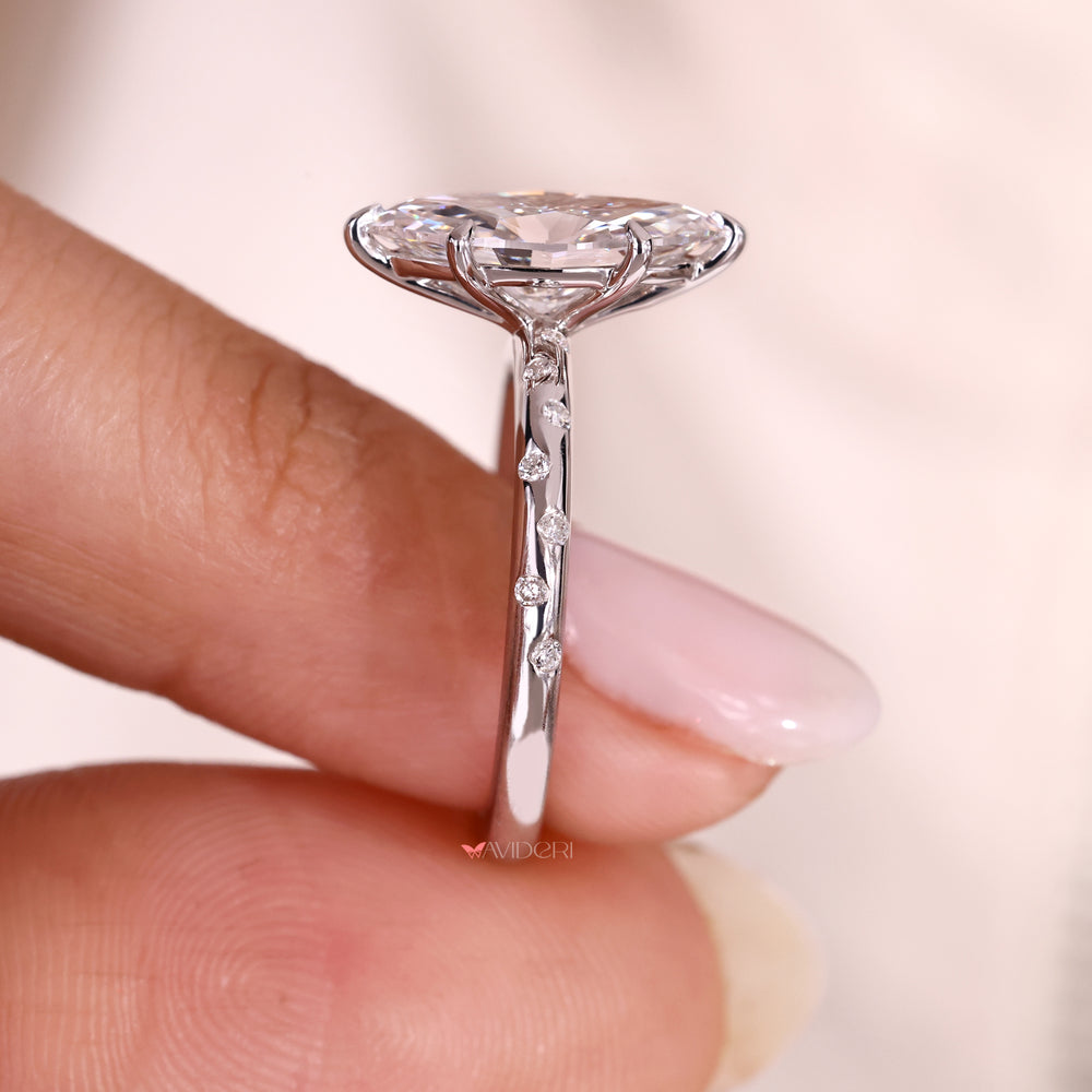 Lab grown marquise cut diamond ring with six claw prongs.
