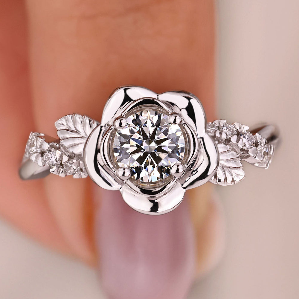 Rose-inspired engagement ring with twisted pave band.
