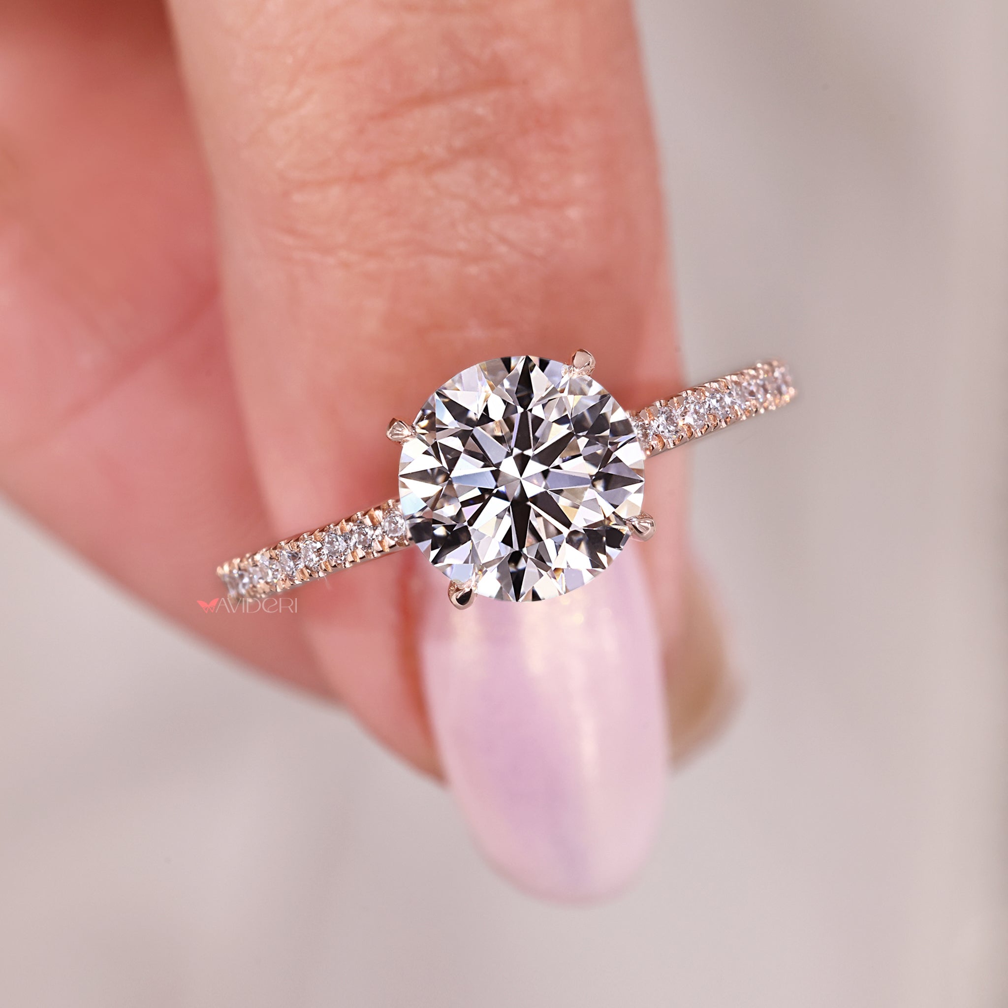 Pave setting band matched with round diamond hidden halo and handmade ring finish.
